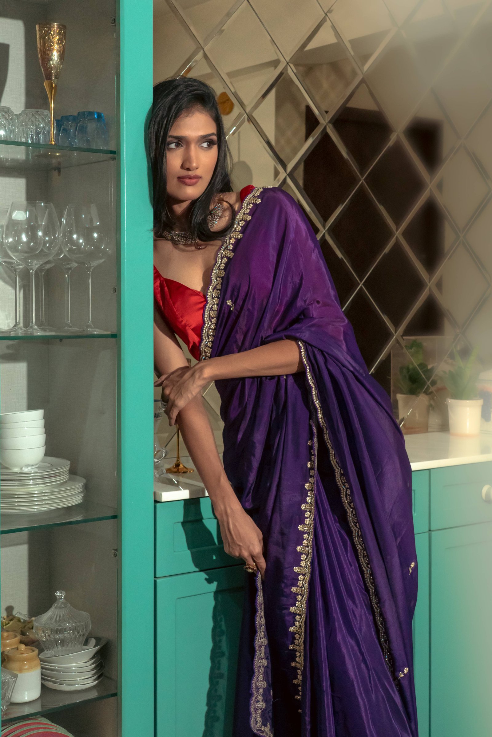 Woman wearing a handcrafted rare deep purple saree 